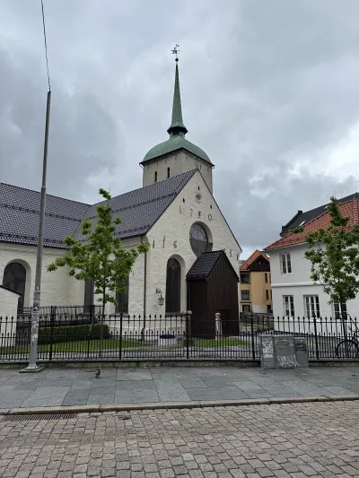 A historic church rising above the rooftops of Bergen city centre