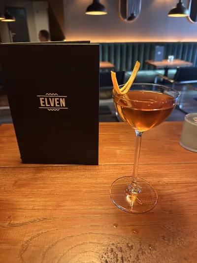 A whiskey cocktail with garnish at Elven bar