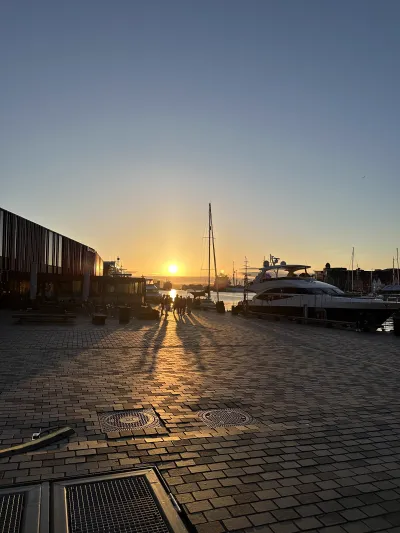 Golden sunset light reflecting off the still water of Bergen harbour