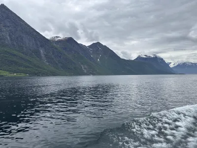 Spring fjord landscape with snow still visible on the distant mountain peaks